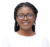 A young professional smiles in a portrait in front of a simple gray background